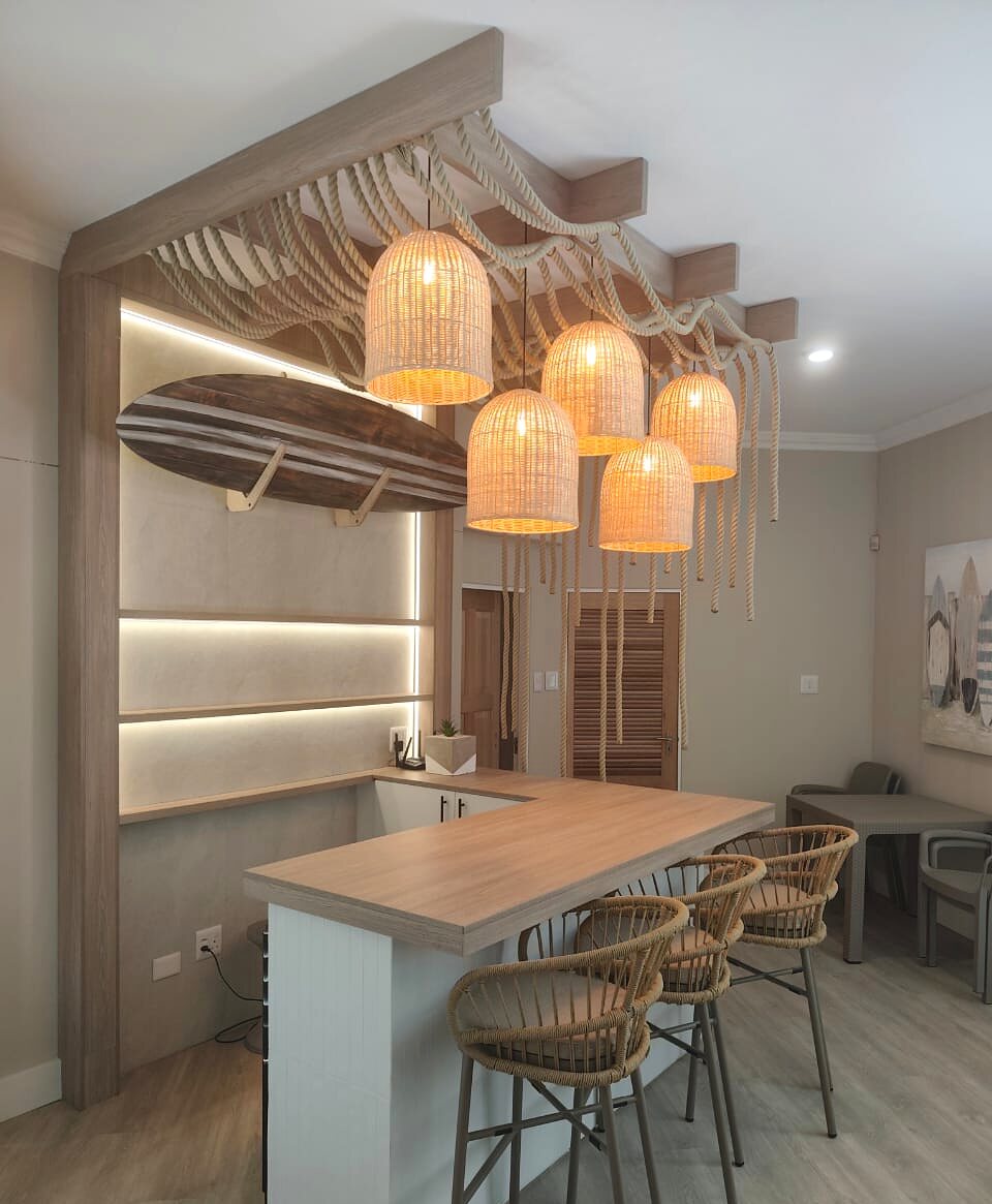 Coastal bar interior with woven pendant lighting installed by Open Circuit